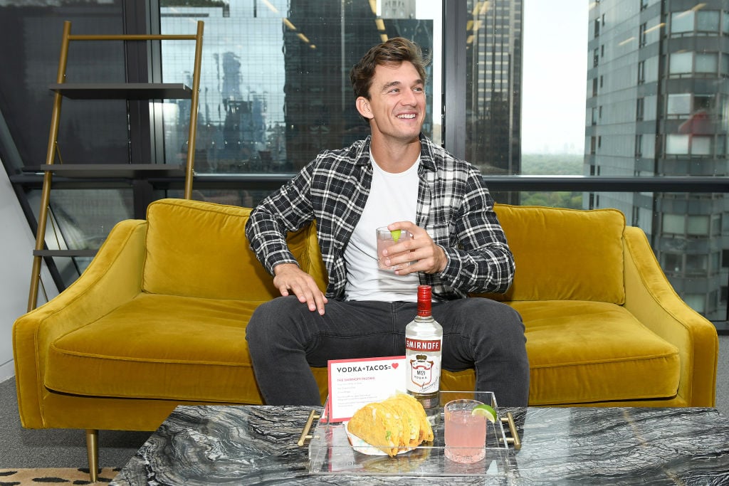 Tyler Cameron on sofa in New York City.