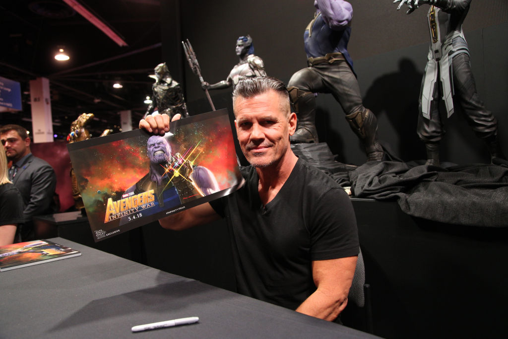 Actor Josh Brolin holds a promo picture of his character Thanos from the Avengers Infinity War movie