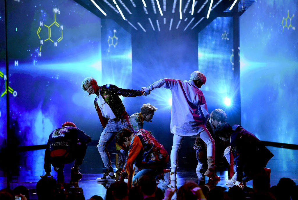 Music group BTS performs onstage during the 2017 American Music Awards