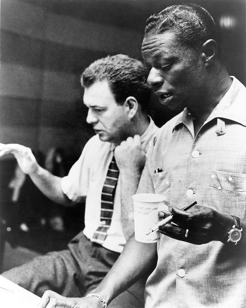 Arranger and band leader Nelson Riddle (left) and Nat King Cole (right)