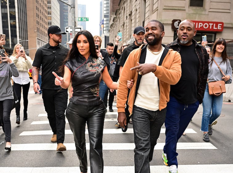 Kanye West and Kim Kardashian walking down the street in New York