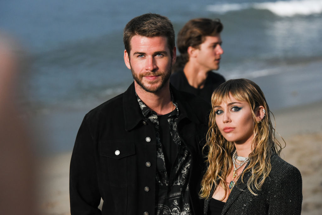 Liam Hemsworth and Miley Cyrus at Saint Laurent mens spring summer 20 show 