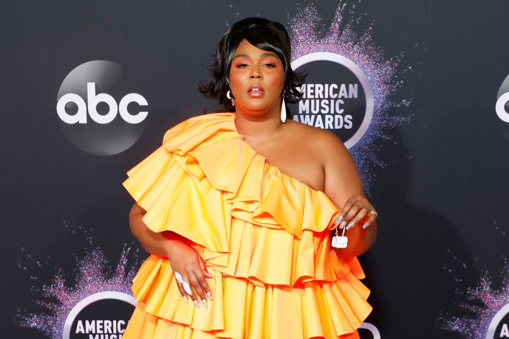 Lizzo poses on the red carpet at the American Music Awards