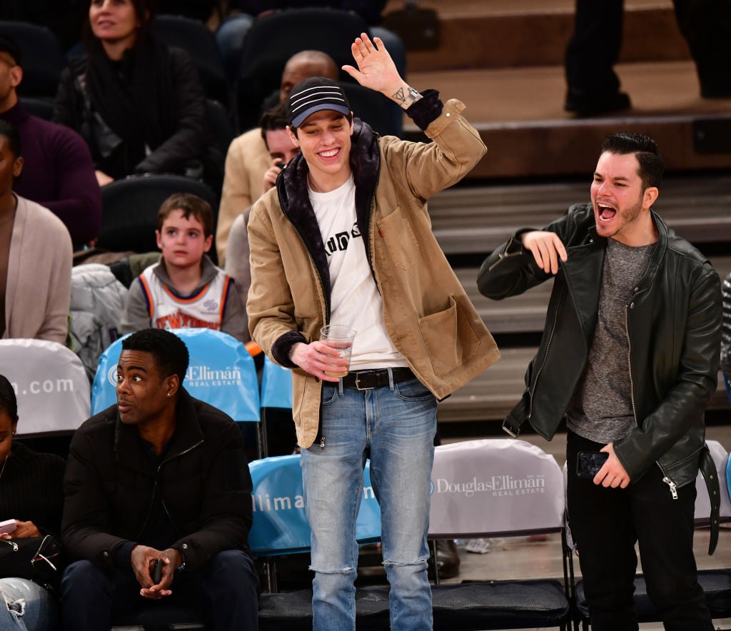 Chris Rock, Pete Davidson, and guest attend the New York Knicks Vs Toronto Raptors game