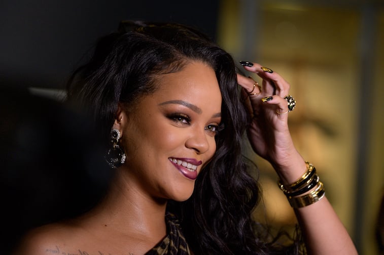Rihanna smiling at a formal event