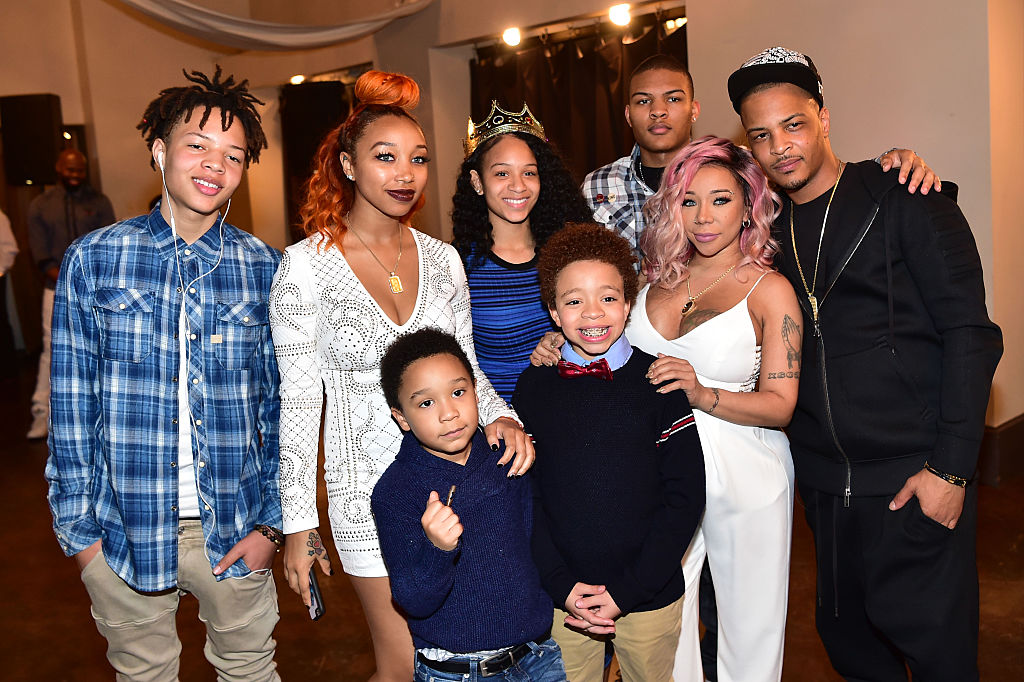 T.I. and his wife Tameka "Tiny" Harris at an event with their blended family