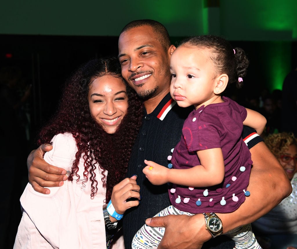 T.I. poses with his daughters Deyjah Harris and Heiress Diana Harris.