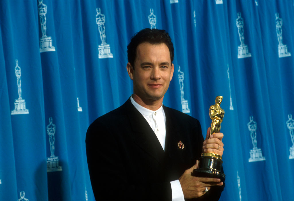 Tom Hanks receives his Oscar at the Academy Awards in 1995