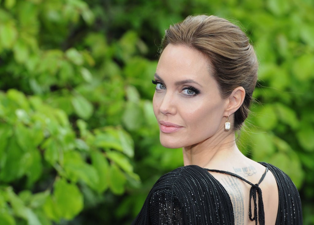 Angelina Jolie attends a private reception as costumes and props from Disney's "Maleficent" are exhibited.