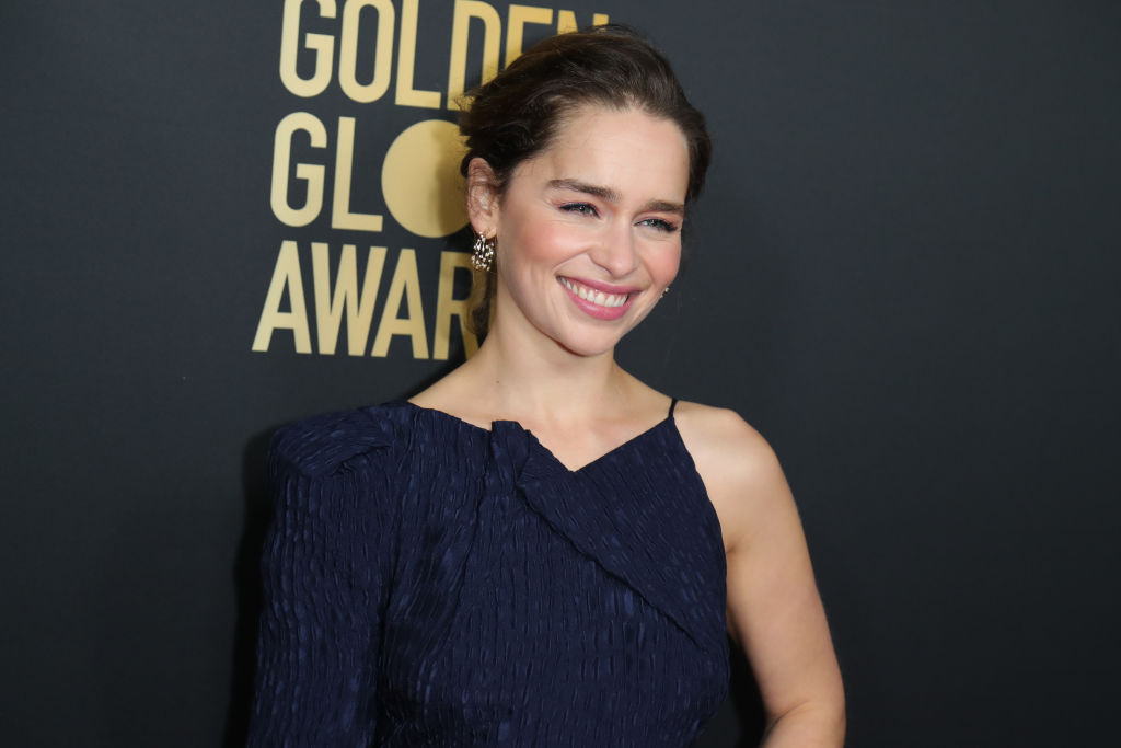 Emilia Clarke poses at the HFPA And THR Golden Globe Ambassador Party.