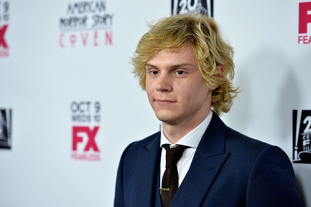 Evan Peters poses at the premiere of FX's 'American Horror Story: Coven,' the season where he played Kyle Spencer.