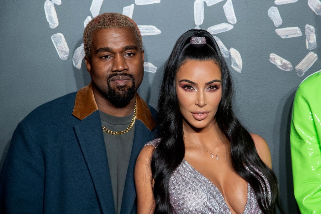 Kanye West and Kim Kardashian West attend the Versace fall 2019 fashion show.