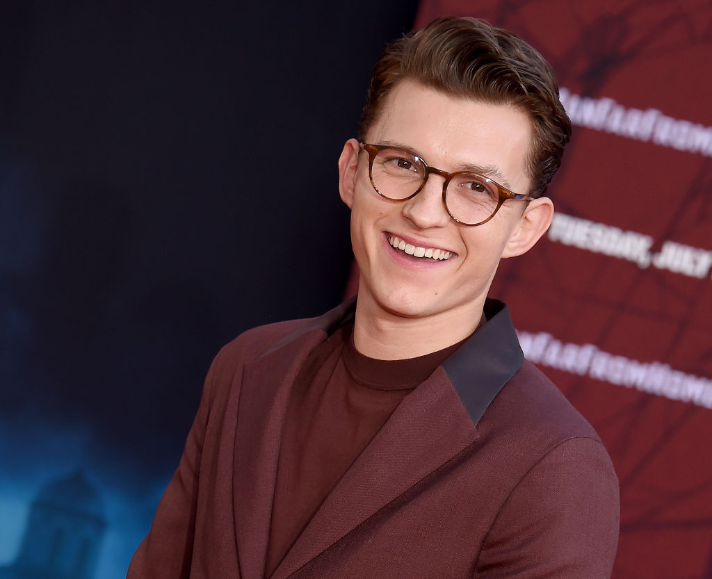 Tom Holland posing on the red carpet for 'Spider-Man: Far From Home.'