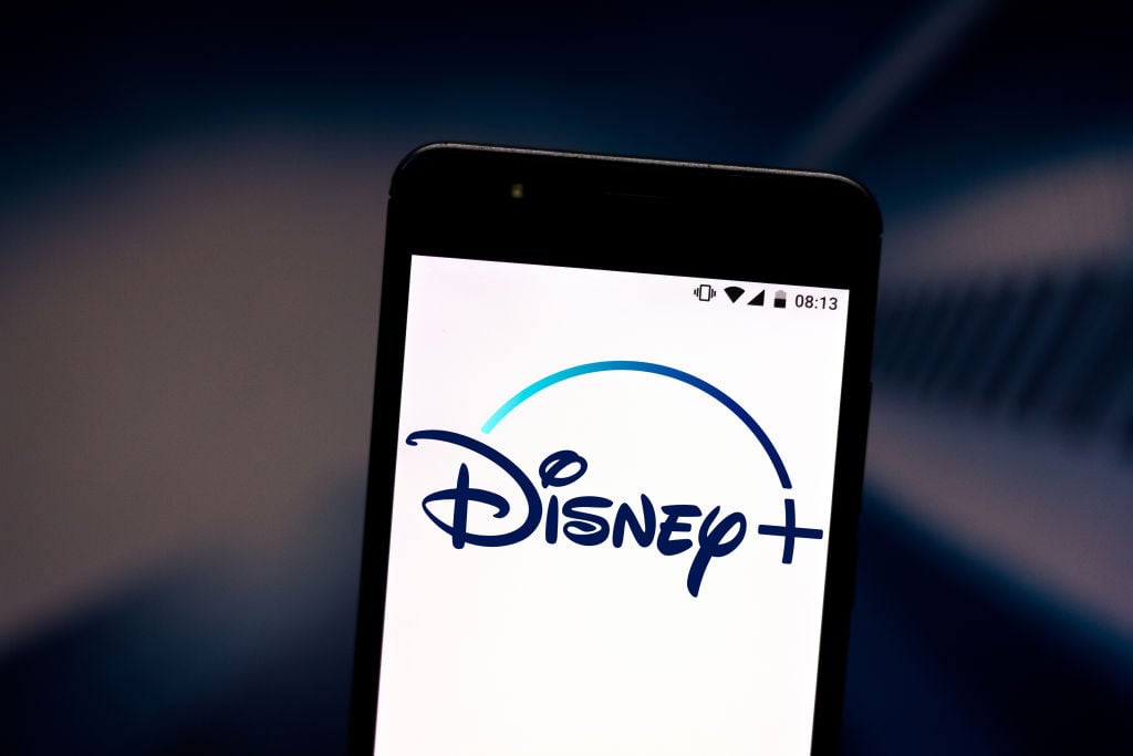 Photo illustration a Disney+ (Plus) logo