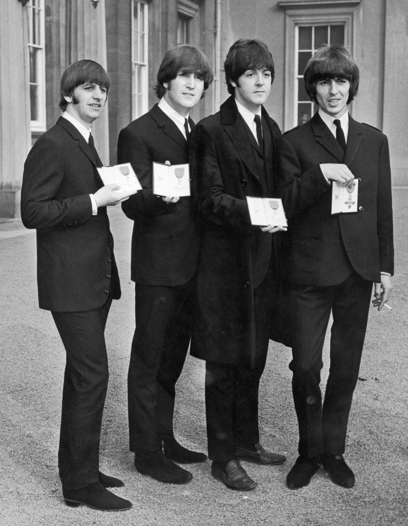 The Beatles with their Member of the Order of the British Empire awards from Queen Elizabeth