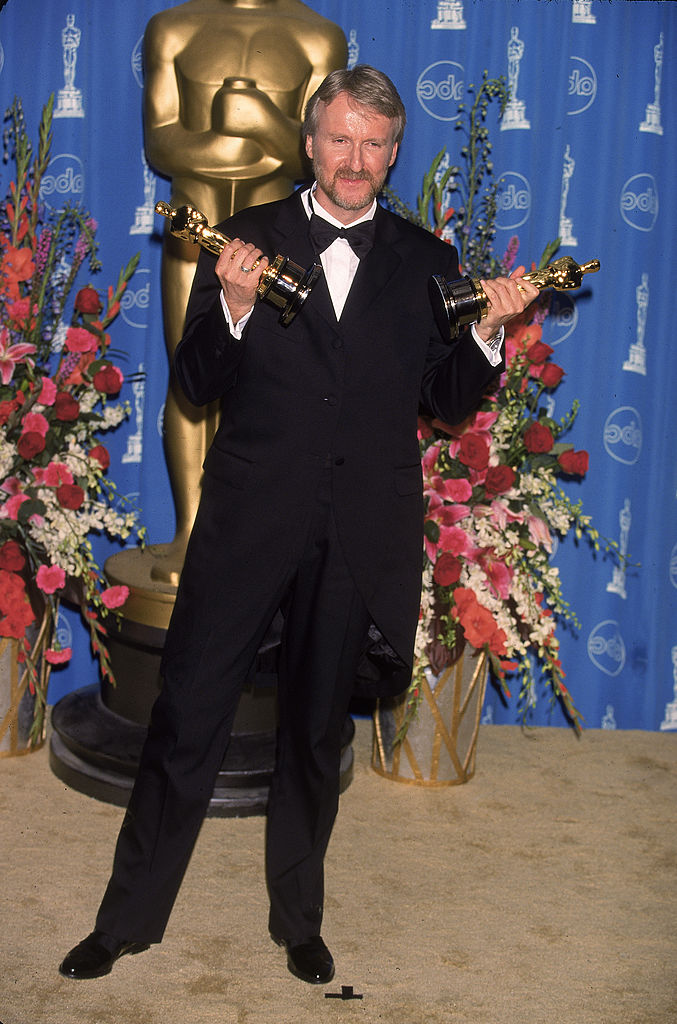 James Cameron holding 2 of the Oscar Awards he received for 'Titanic' in 1998