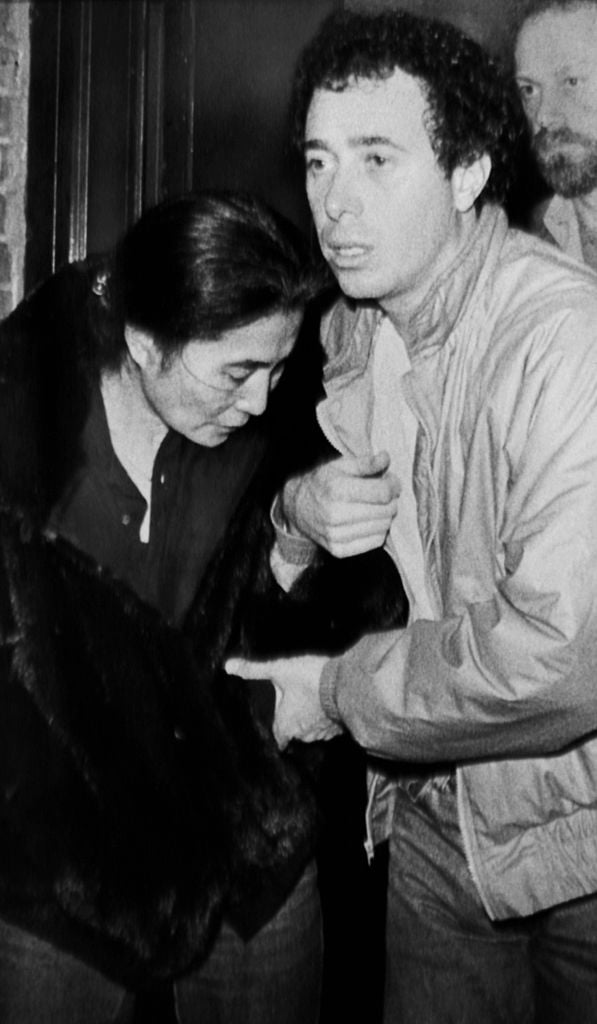 Yoko Ono and David Geffen leaving Roosevelt Hospital after learning John Lennon was dead, 1980