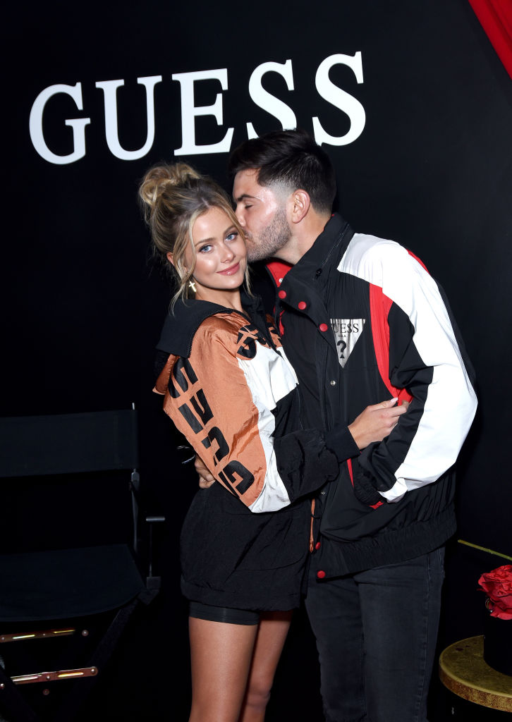 Hannah Godwin and Dylan Barbour | Presley Ann/Getty Images for GUESS?, Inc.
