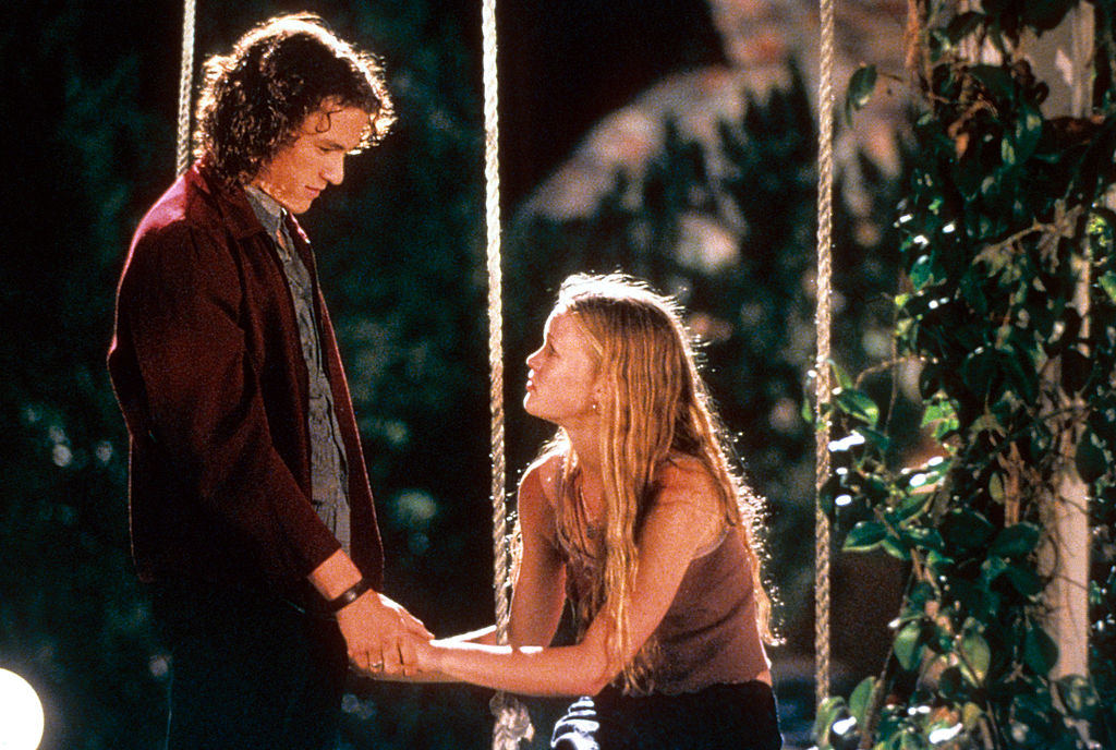 Heath Ledger and Julia Stiles at swing in a scene from the film '10 Things I Hate About You', 1999