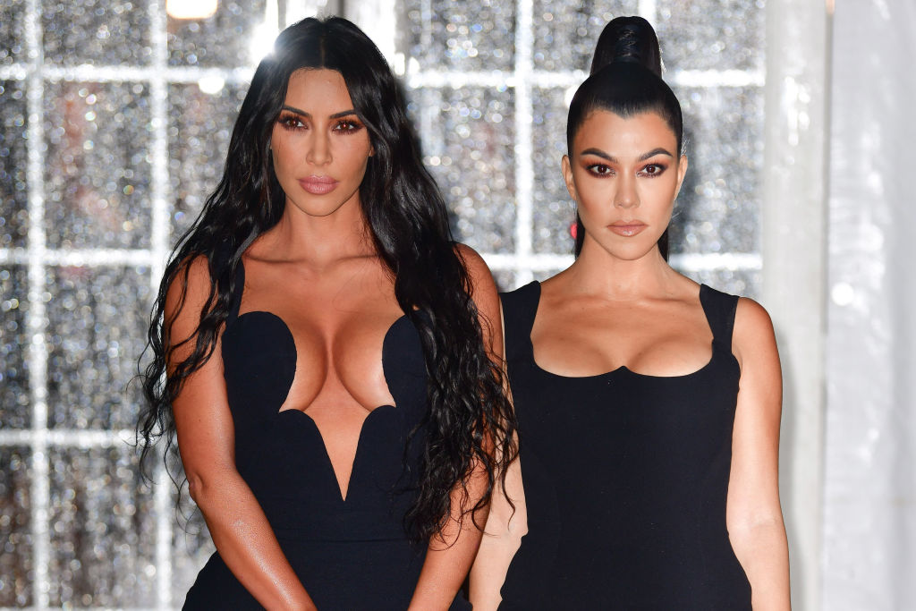 Kim Kardashian West and Kourtney Kardashian at an event in 2019