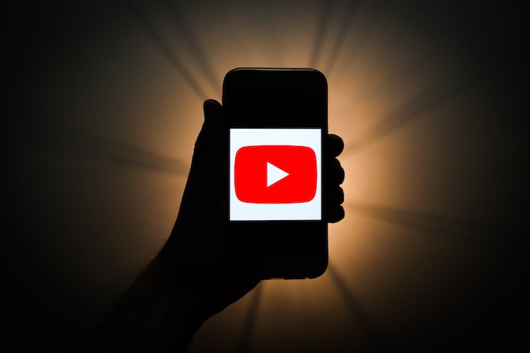 YouTube logo shown on a phone screen