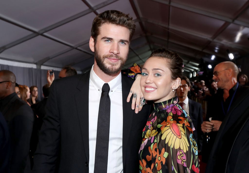 Liam Hemsworth and Miley Cyrus at a movie premiere.