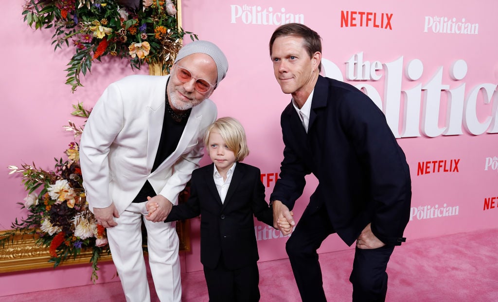 Ryan Murphy, with his son Logan Miller and his husband David Miller pose on the pink carpet at 'The Politician' New York Premiere in New York City.