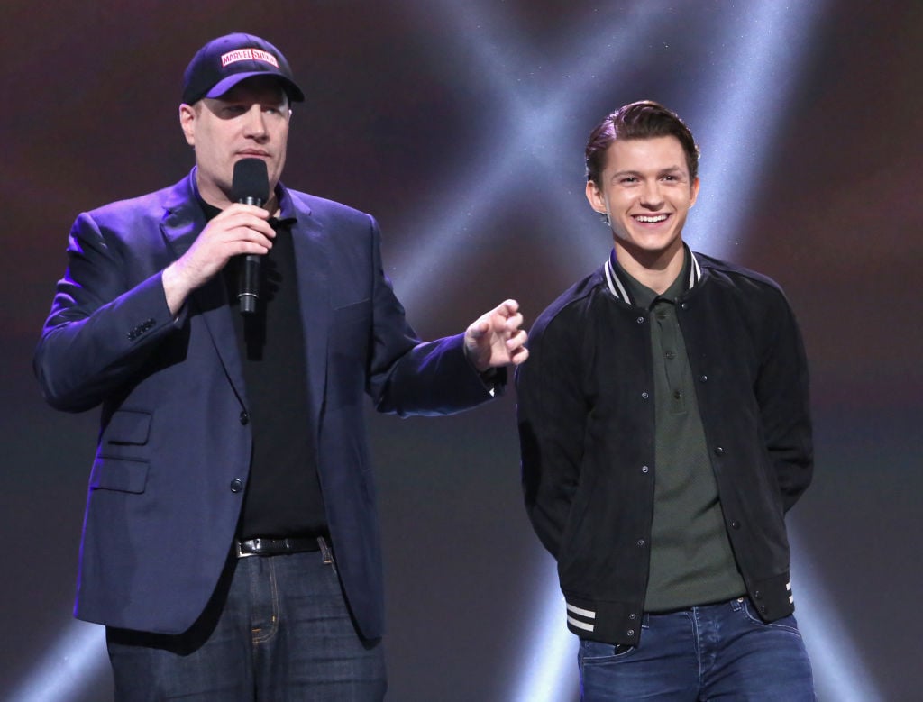 Kevin Feige and Tom Holland present at Disney's D23 Expo in 2017. 