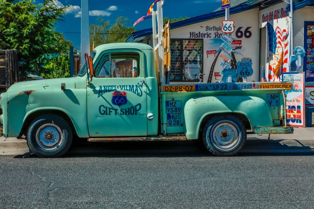 Green pickup truck on Main Street, Seligman on historic Route 66, Arizona.