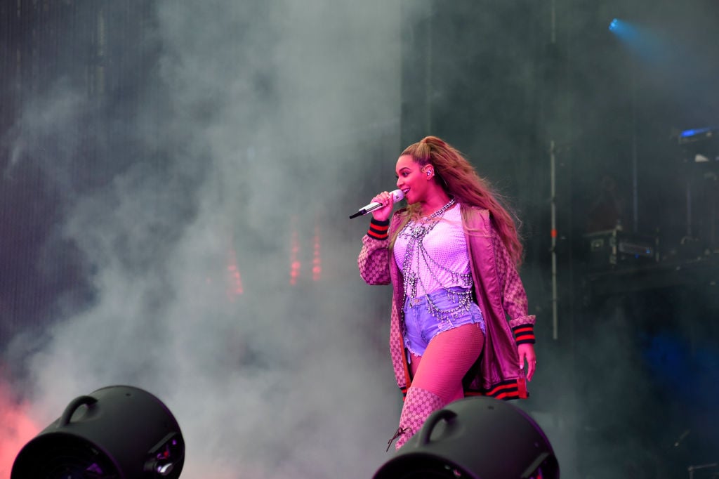 Beyoncé holding a microphone on stage
