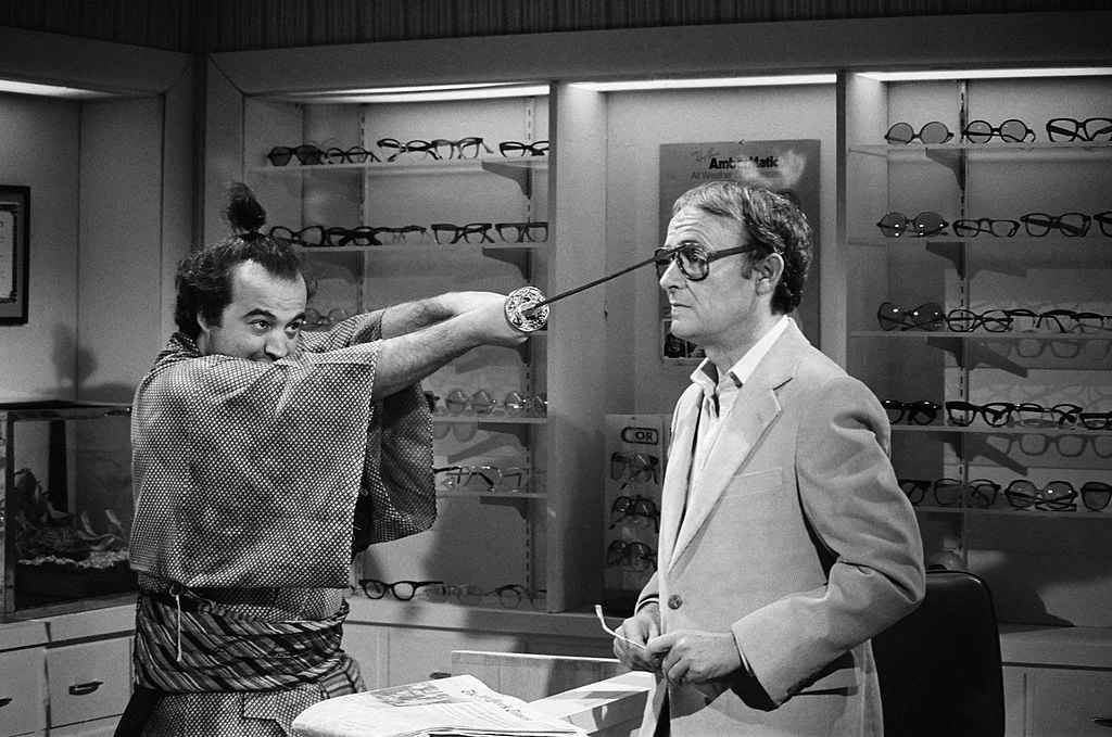 Buck Henry and John Belushi in an optometrist's office, during a Samurai skit