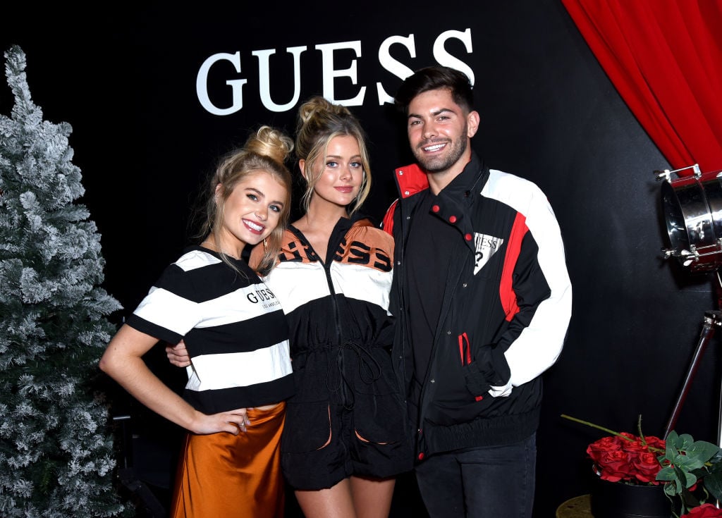 Demi Burnett, Hannah Godwin, and Dylan Barbour attend GUESS Kicks-off Holiday Season at The Peppermint Club on Nov. 07, 2019