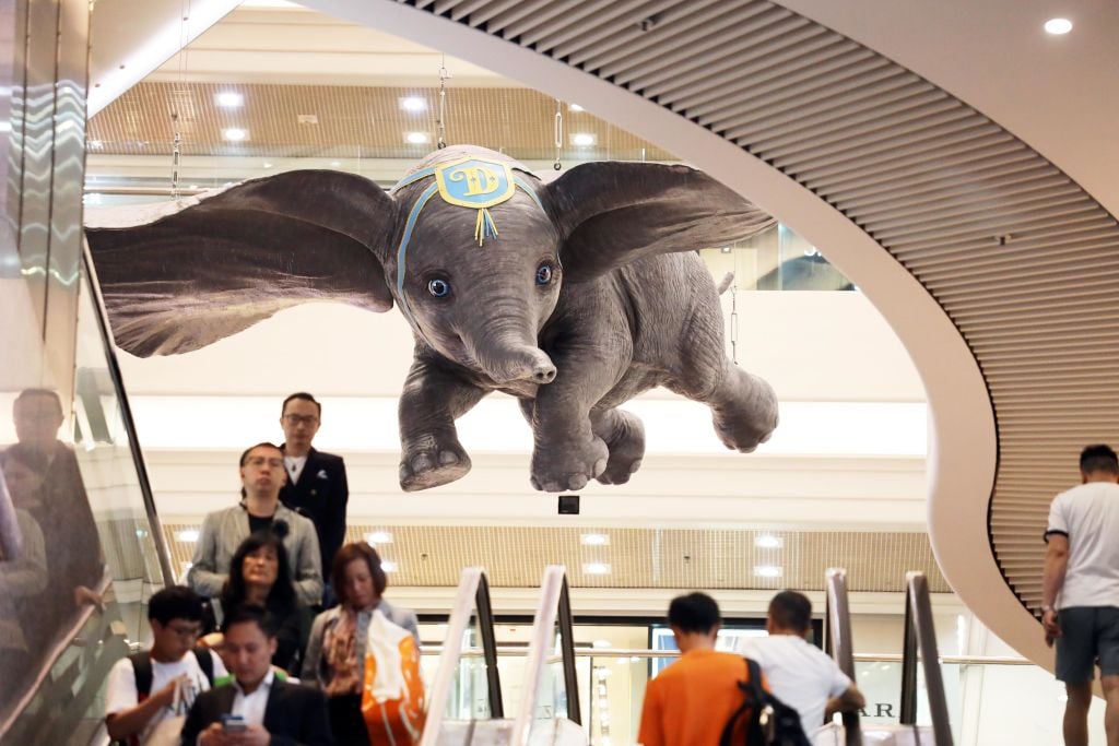 People visit an exhibition with the theme of movie 'Dumbo' at Times Square