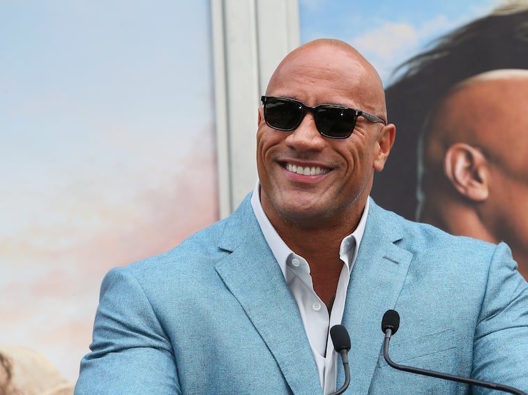 Dwayne Johnson speaks at an awards ceremony