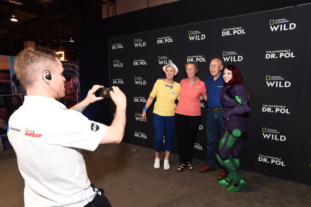 Dr. Jan Pol and his wife, Diane Pol, of 'The Incredible Dr. Pol' pose with fans