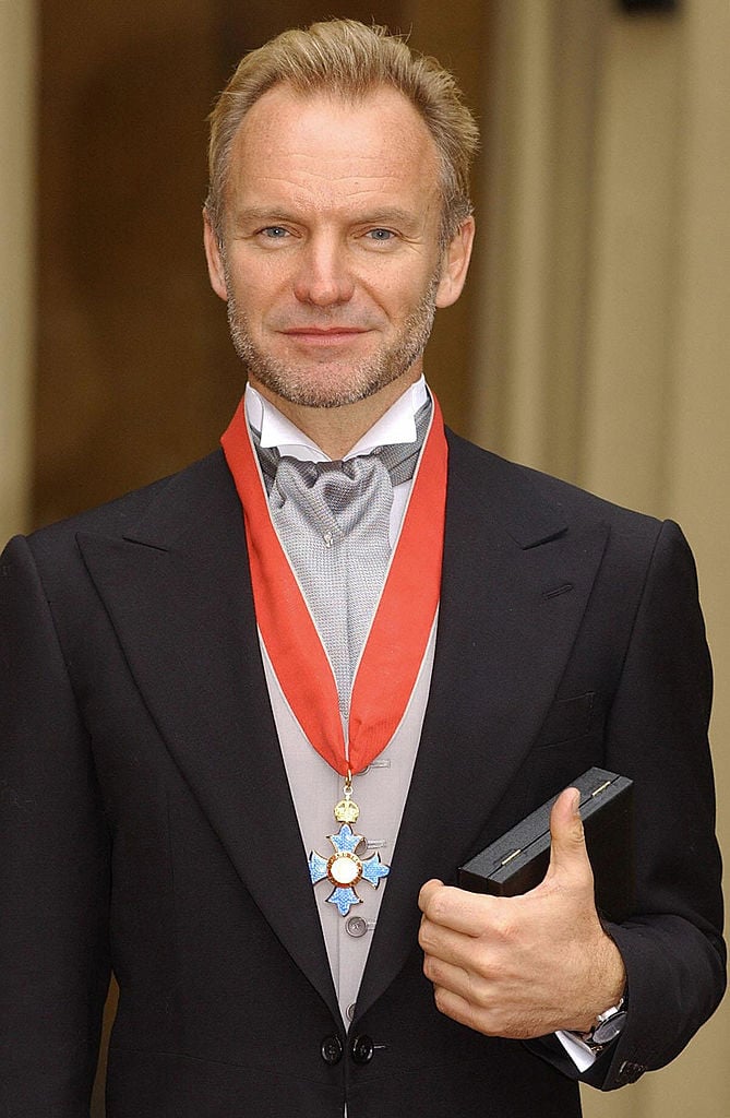 Sting with is CBE medal in 2003