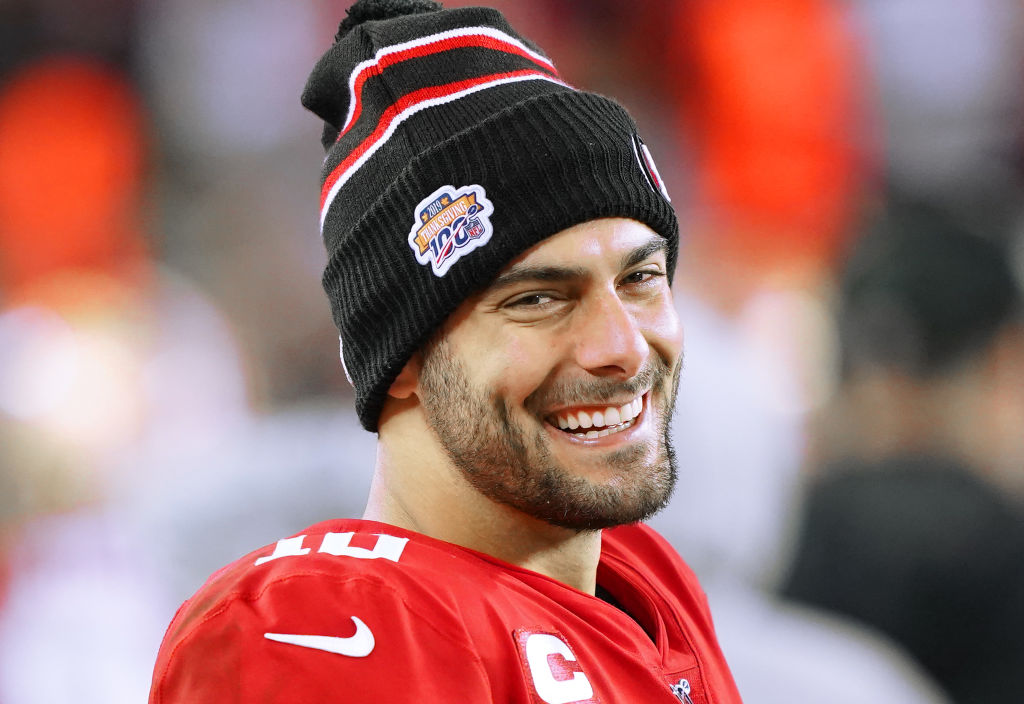 Jimmy Garoppolo #10 of the San Francisco 49ers looks on from the sidelines against the Green Bay Packers