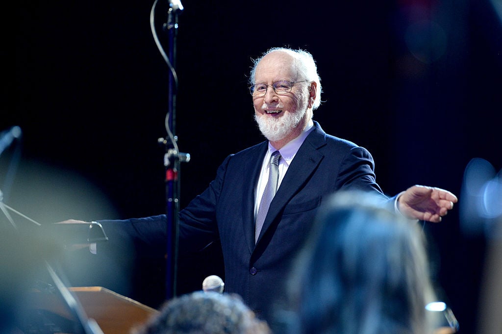 John Williams performing onstage as a conductor.