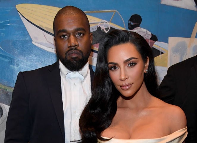 Kanye West and Kim Kardashian West at a party in December 2019