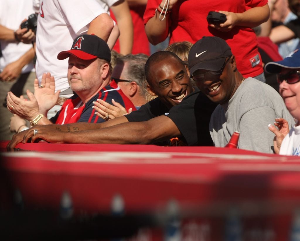 Kobe Bryant's father Joe Bryant smiles and talks to his son.JPG