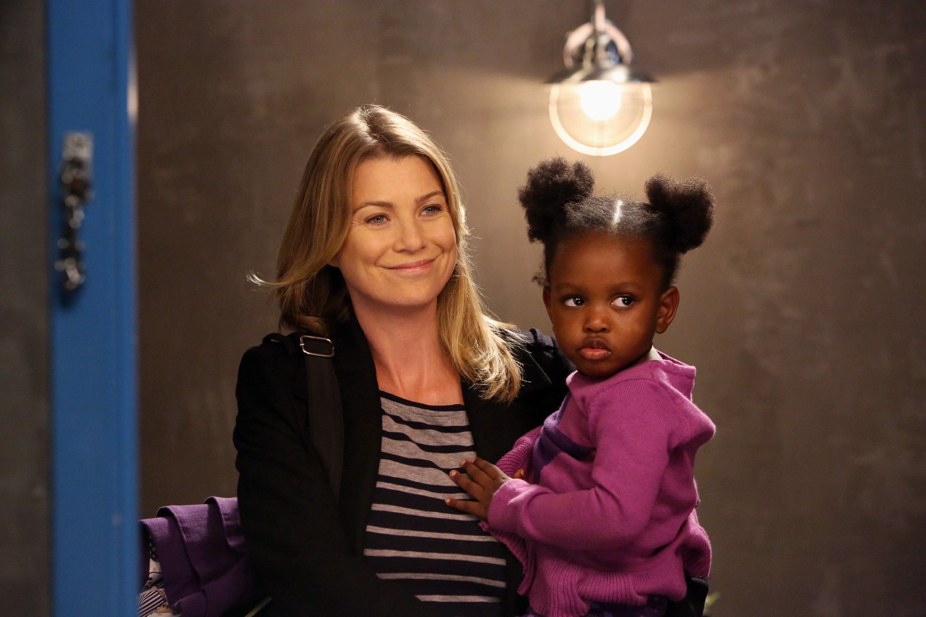 In a scene from 'Grey's Anatomy,' Meredith Grey with one of her kids.