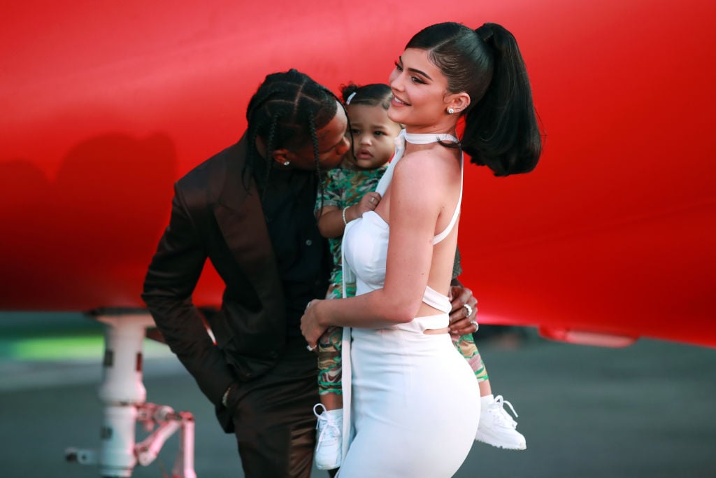 Travis Scott, Stormi Webster, and Kylie Jenner on the red carpet in August 2019