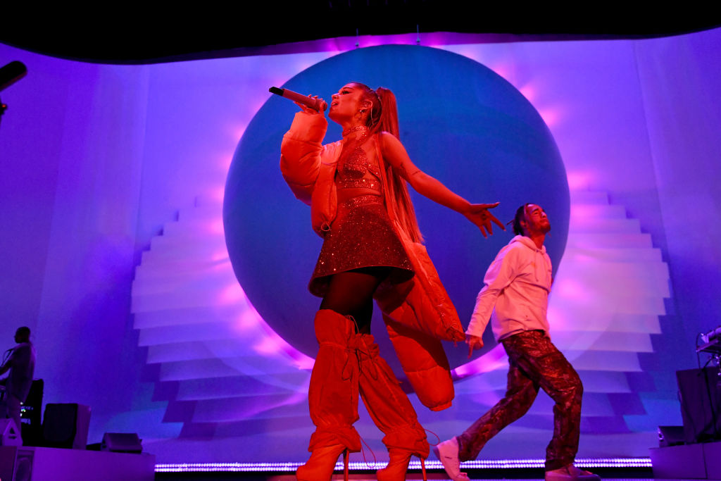 Ariana Grande performs on stage with Mikey Foster of Social House during her 'Sweetener World Tour' on August 19, 2019, in London, England.