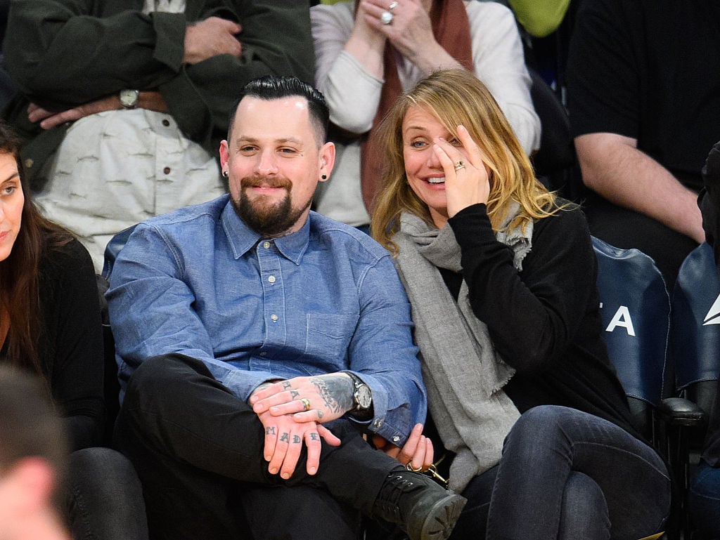 Benji Madden and Cameron Diaz at basketball game 