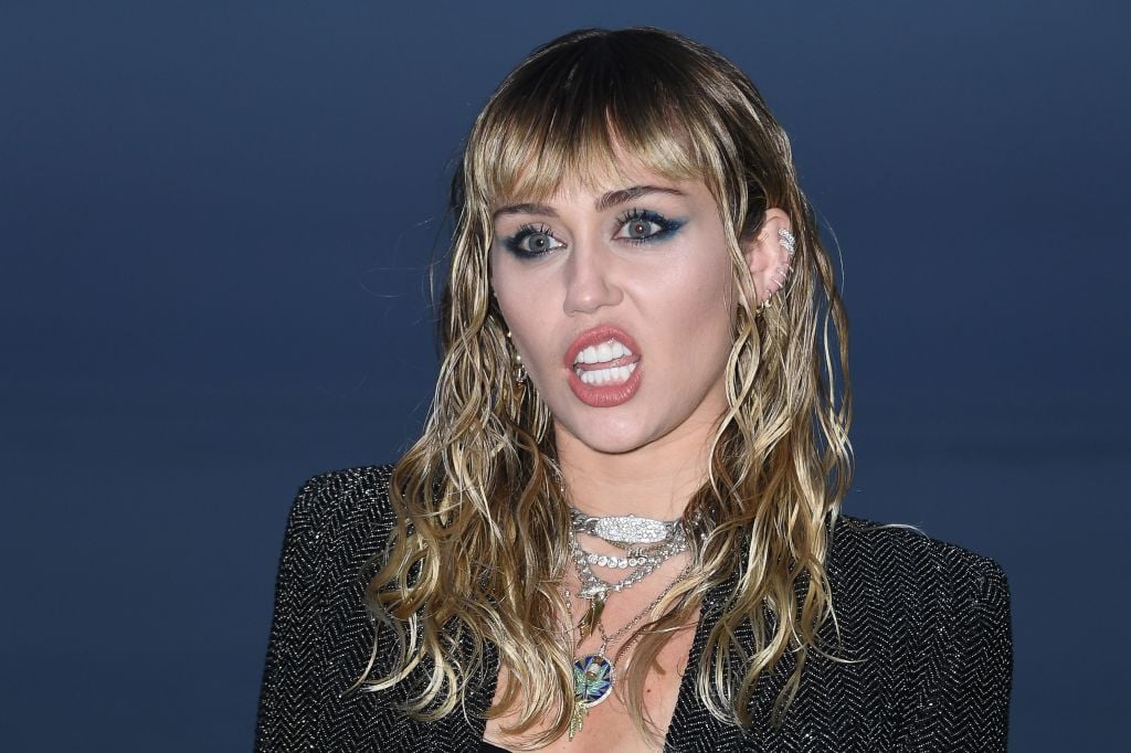 Miley Cyrus arrives for the Saint Laurent Men's Spring-Summer 2020 runway show.