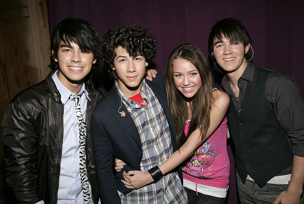 Joe Jonas, Nick Jonas, Miley Cyrus, and Kevin Jonas