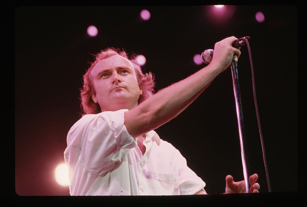 Phil Collins with a microphone