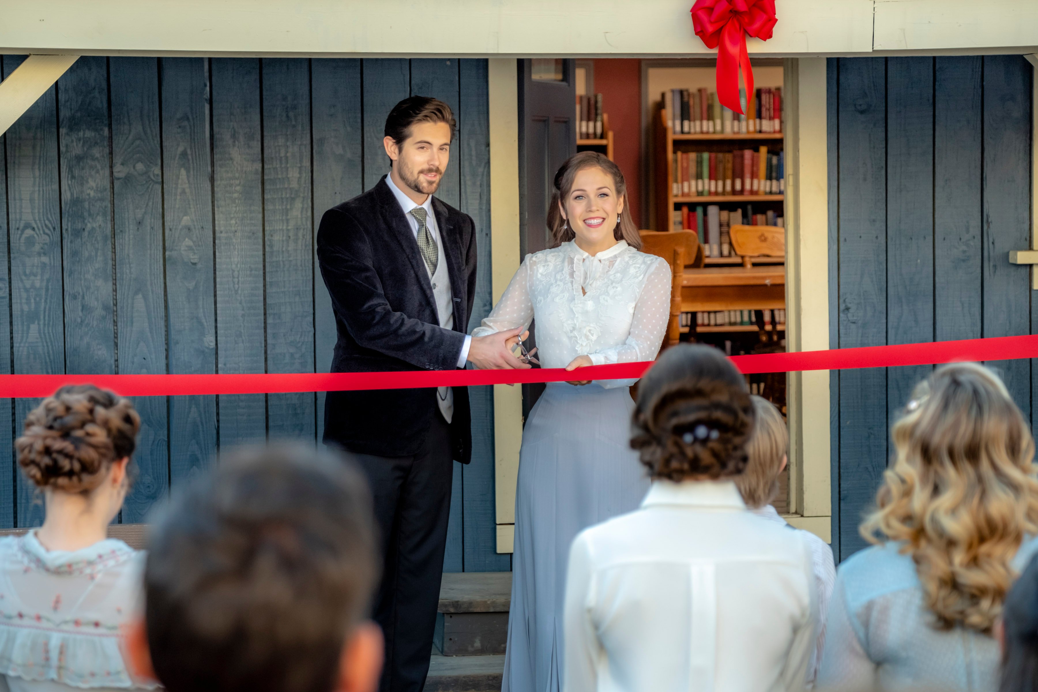 Lucas and Elizabeth cutting a ribbon