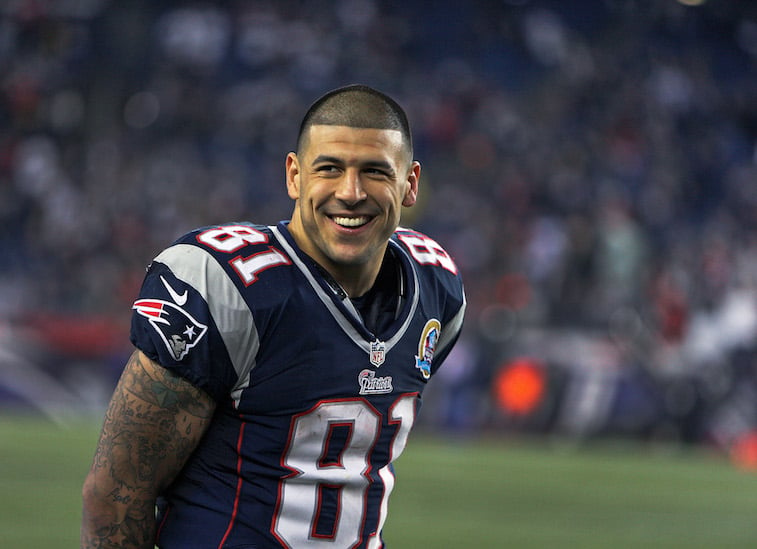 Aaron Hernandez plays football