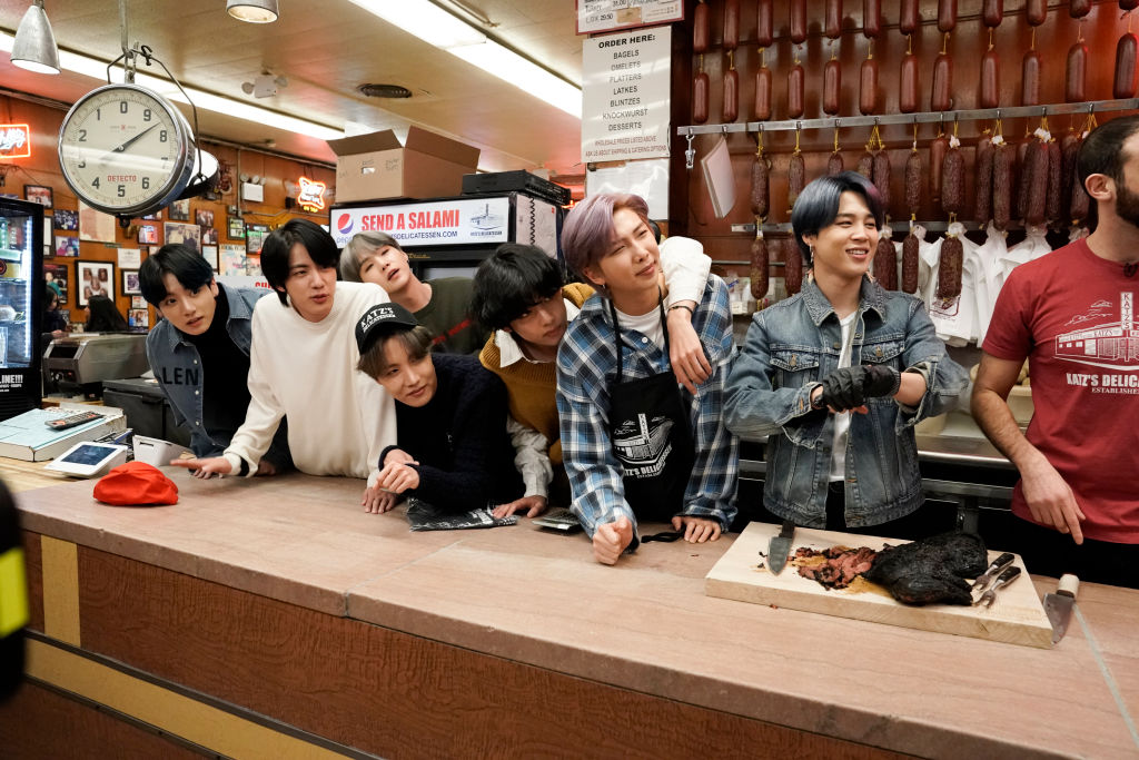 Jungkook, Jin, SUGA, J-Hope, V, RM, and Jimin of BTS inside Katz's Deli